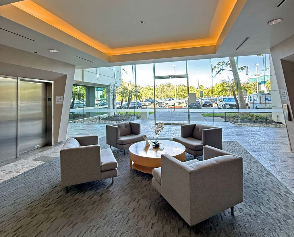Seating area and glass entrance lobby at 5230 Las Virgenes Road, Calabasas