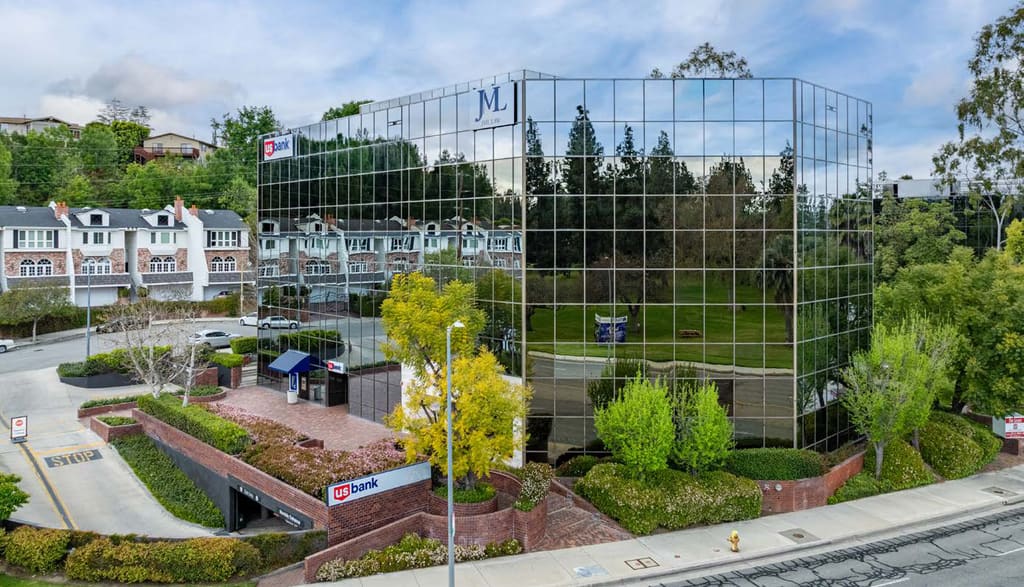 Glass-clad office building with landscaped entry at 5855 Topanga Canyon Boulevard, Woodland Hills